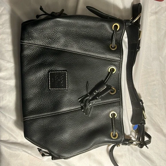 Dooney & Bourke Drawstring bag with tassels and duck tag. - Picture 1 of 12